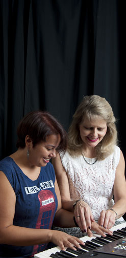 Piano teacher, Vivien Chao, with one of her adult students.
